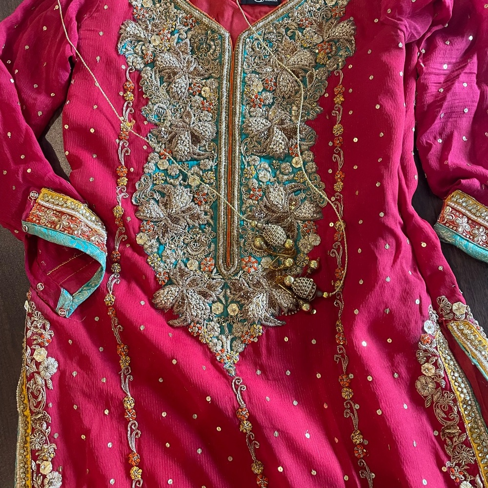 Red fully embroidered shirt with orange chiffon dubatta and pants